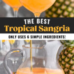 pitcher and glasses of tropical sangria with slices of fresh pineapple and oranges