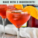 Two glasses of Campari Spritz with ice and orange slices