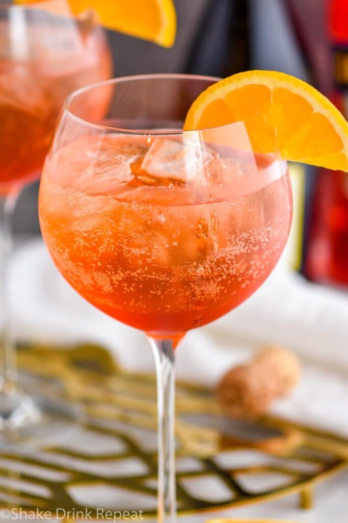 Aperol spritz cocktail in glass with ice and slice