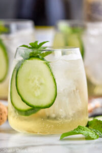 glass of Lillet Spritz with fresh mint leaves and cucumber slices