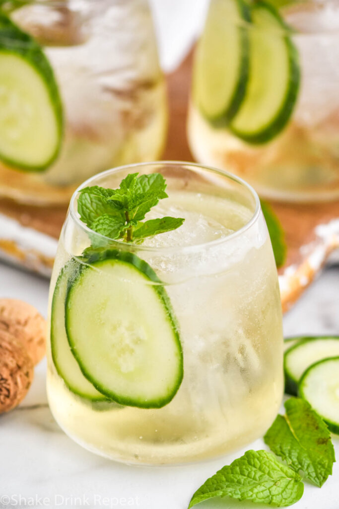 glasses of Lillet Spritz with ice, fresh mint leaves, and cucumber slices