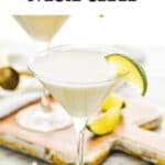 two martini glasses of Key Lime Martini with slice of lime on the rim