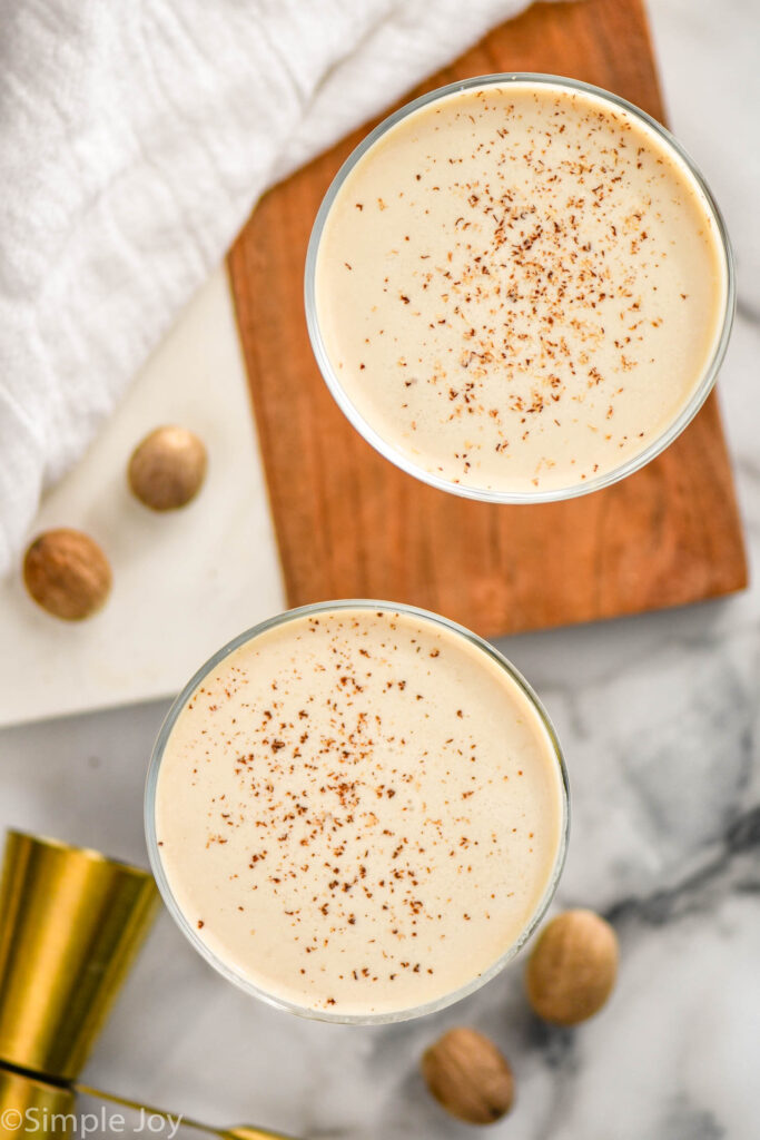 two glasses of Brandy Alexander sprinkled with nutmeg