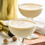 two glasses of Brandy Alexander recipe with nutmeg garnish