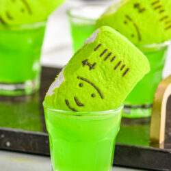 shot glasses of Frankenstein Shot recipe with green peep garnish
