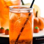 two glasses of Drunk Pumpkin with ice, straw, and pumpkin candies