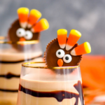 two glasses of Drunk Turkey recipe with chocolate syrup drizzle and peanut butter cup turkey garnish