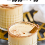 two glasses of Fireball Eggnog recipe rimmed with cinnamon sugar and garnished with cinnamon sticks