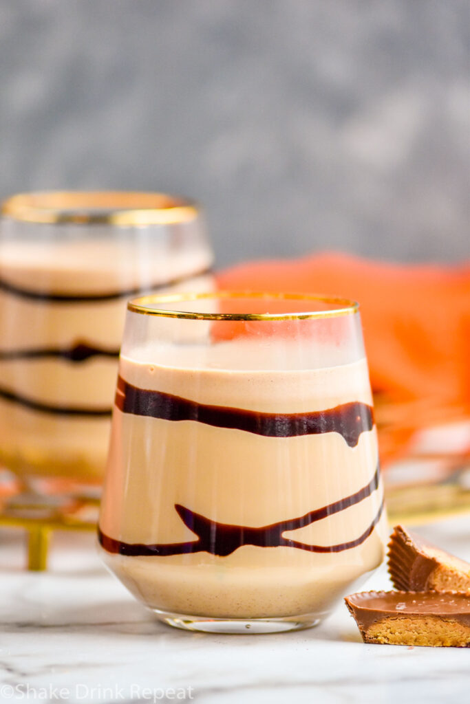two glasses of Drunk Turkey recipe with chocolate syrup surrounded by peanut butter cups