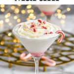 glass of Candy Cane Martini topped with whipped cream and crushed candy canes