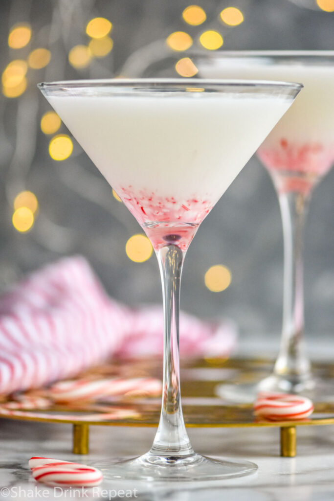 two glasses of candy cane martini recipe with crushed candy canes