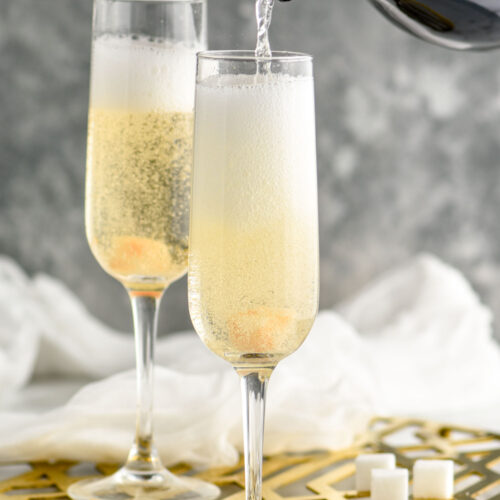 champagne being poured into a champagne flute