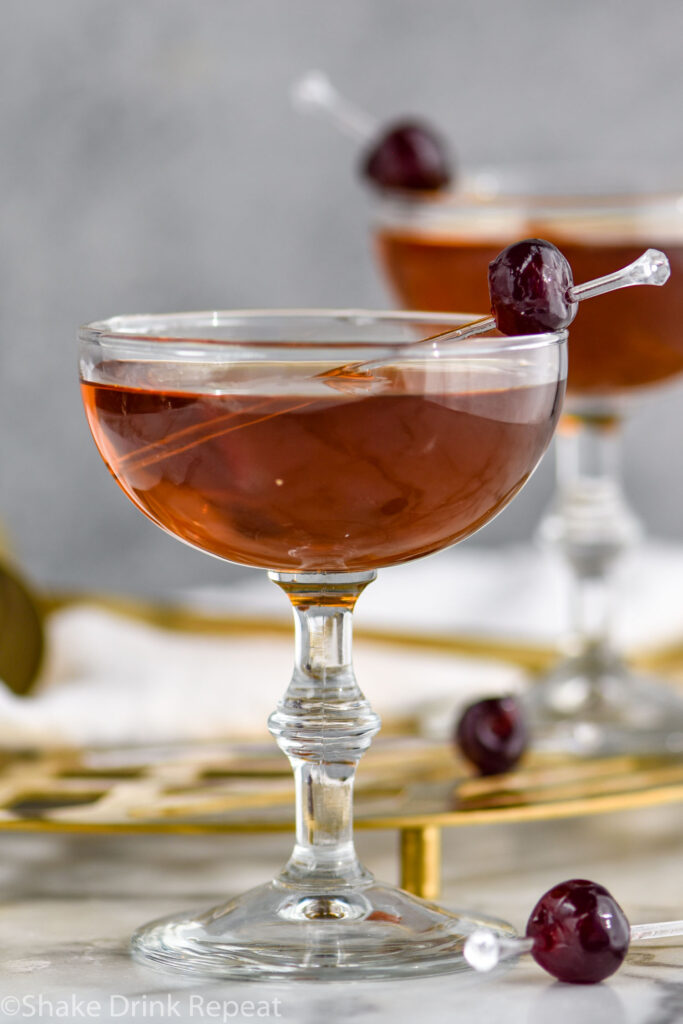 two glasses of Corpse Reviver recipe garnished with a cherry