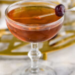 glass of Corpse Reviver recipe garnished with a Luxardo cherry