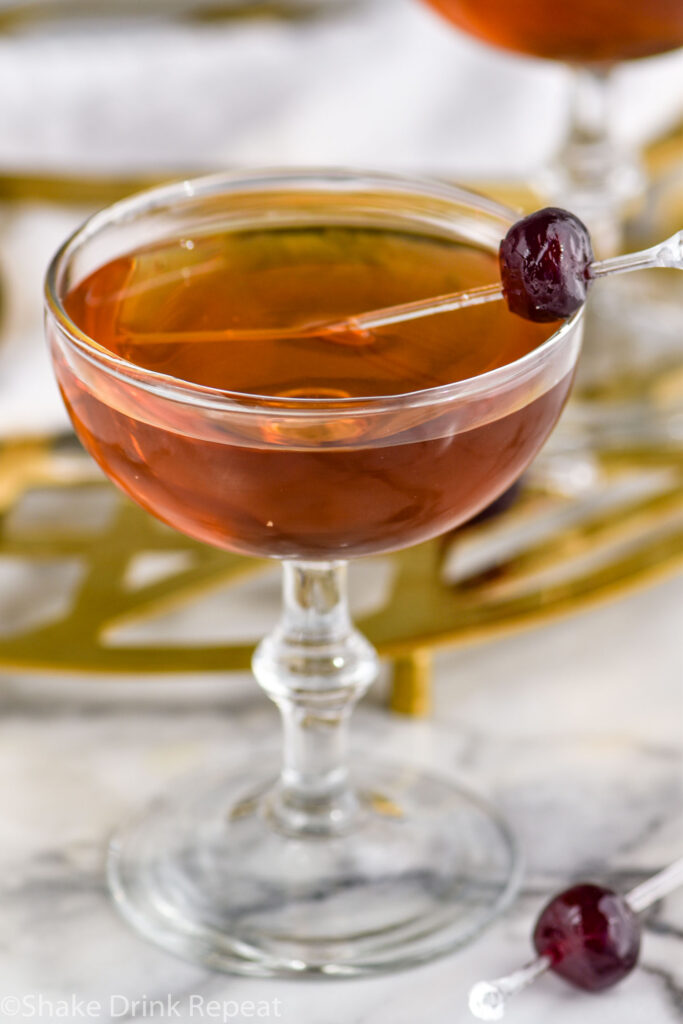 glass of Corpse Reviver recipe garnished with a Luxardo cherry