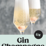 bottle of champagne pouring into two champagne flutes of Gin Champagne Cocktail