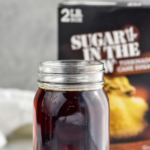 jar of homemade Demerara Syrup with box of Demerara sugar in the background