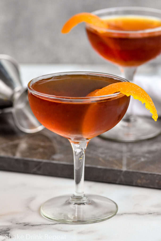 Two glasses of Hanky Panky cocktail recipe garnished with an orange peel