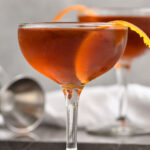 Two glasses of Hanky Panky cocktail recipe garnished with an orange peel