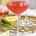 two glasses of Scarlett O'Hara cocktail garnished with a lime