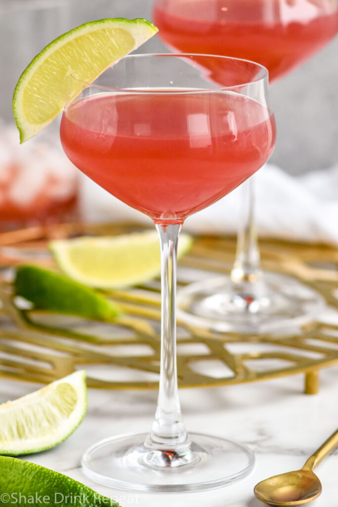 two glasses of Scarlett O'Hara cocktail garnished with a lime