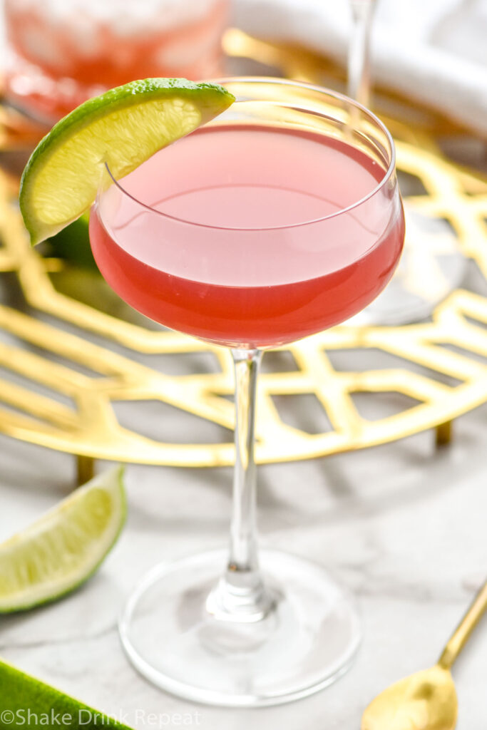 glass of Scarlett O'Hara cocktail garnished with a lime