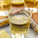 shot glasses of chocolate cake shots with slices of lemon