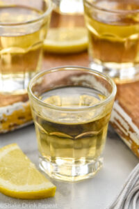 shot glasses of chocolate cake shots with slices of lemon