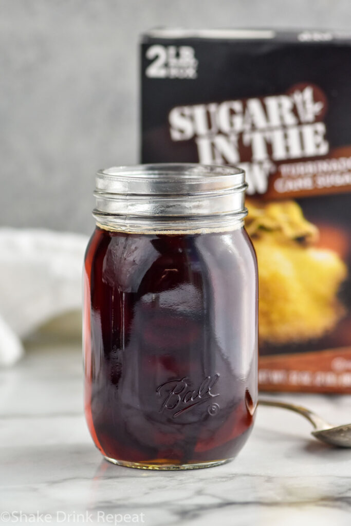 jar of homemade Demerara Syrup with box of Demerara sugar in the background