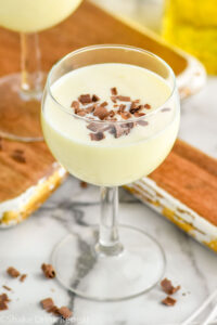 Glass of Golden Cadillac recipe garnished with chocolate shavings