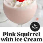 glass of Pink Squirrel with Ice Cream garnished with whipped cream and a cherry