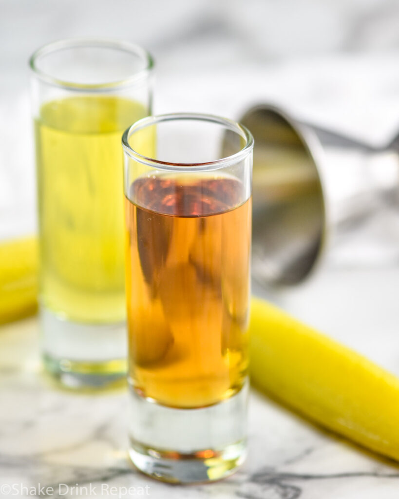 shot glass of pickle juice and shot glass of whiskey to make a pickleback