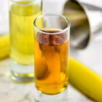 shot glass of pickle juice and shot glass of whiskey to make a pickleback