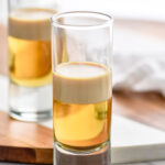 Photo of two shot glasses of Buttery Nipple Shot recipe.