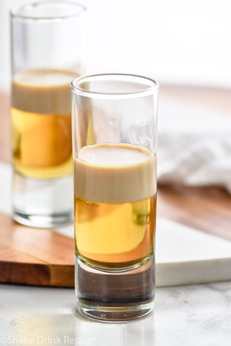 Photo of two shot glasses of Buttery Nipple Shot recipe.