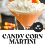 Pinterest graphic of candy corn martini recipe. Text says "candy corn martini make with 2 ingredients! so easy! shakedrinkrepeat.com" Image shows two martini glasses of candy corn martini topped with whipped cream and candy corn pieces. Candy corn pieces surround base of glasses
