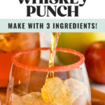 Pinterest graphic of fireball whiskey punch. Text says "Fireball whiskey punch make with 3 ingredients! so easy! shakedrinkrepeat.com" Image shows pitcher of fireball whiskey punch pouring into a glass of ice with red sugar rim.