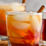 Photo of Chai Old Fashioned garnished with a cinnamon stick.