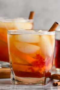 Photo of Chai Old Fashioned garnished with a cinnamon stick.
