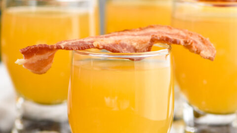 shot glasses of breakfast shot recipe topped with bacon