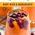 Pinterest photo of Cranberry Orange Margarita Sangria with two photos. Top photo is overhead photo of pitcher of the cocktail and bottom photo is of a stemless win glass filled with the drink with cranberries floating in it. Says 'Cranberry Orange Margarita Sangria, make with 8 ingredients, shakedrinkrepeat.com'