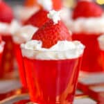 Front close up photo of Santa Hat Jello Shots on a golden stand