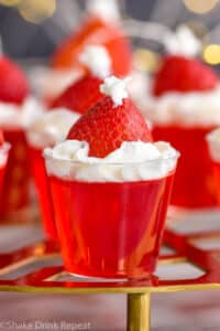 Front close up photo of Santa Hat Jello Shots on a golden stand