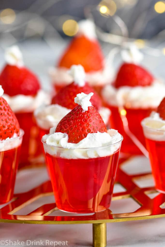 Front facing photo of Santa Hat Jello Shots on a golden stand