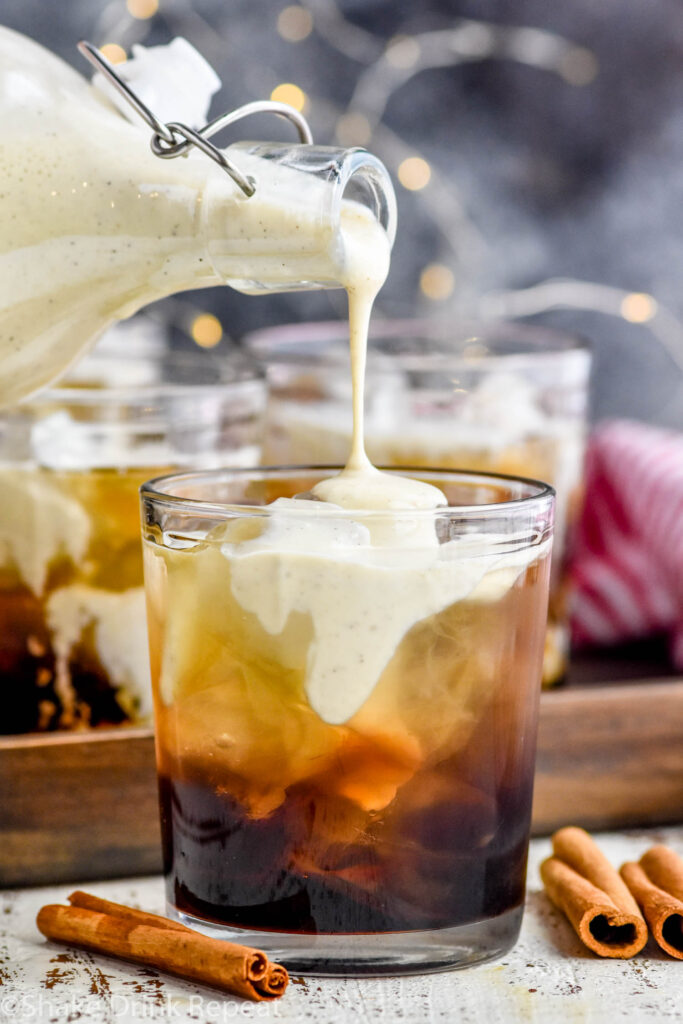 Front facing image of homemade eggnog being poured into an Eggnog White Russian