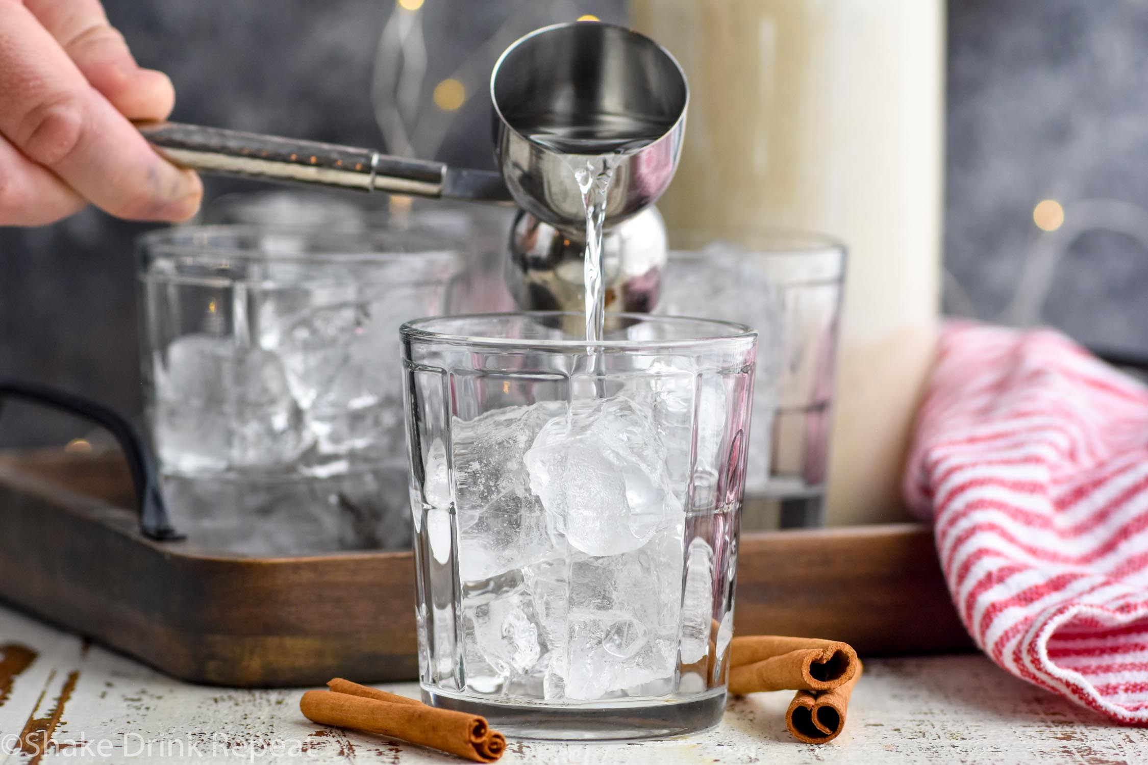 Horizontal image of vodka being poured into an Eggnog White Russian