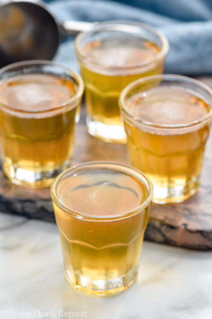 Four three men shots in shot glasses