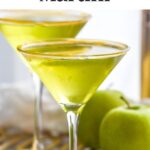 Pinterest graphic for caramel apple martini recipe. Text says, "the best caramel apple martini shakedrinkrepeat.com." Image shows two caramel apple martinis with apples and caramels beside.