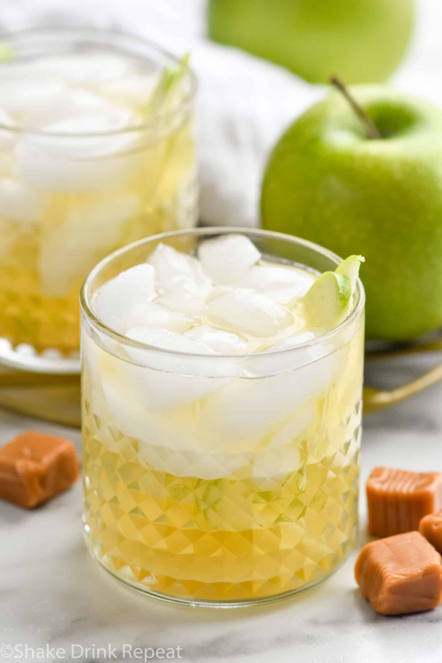 Photo of Caramel Apple Old Fashioned with apples and caramel beside