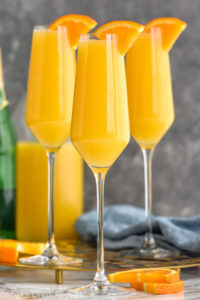 Side view of Non Alcoholic Mimosas garnished with orange slices